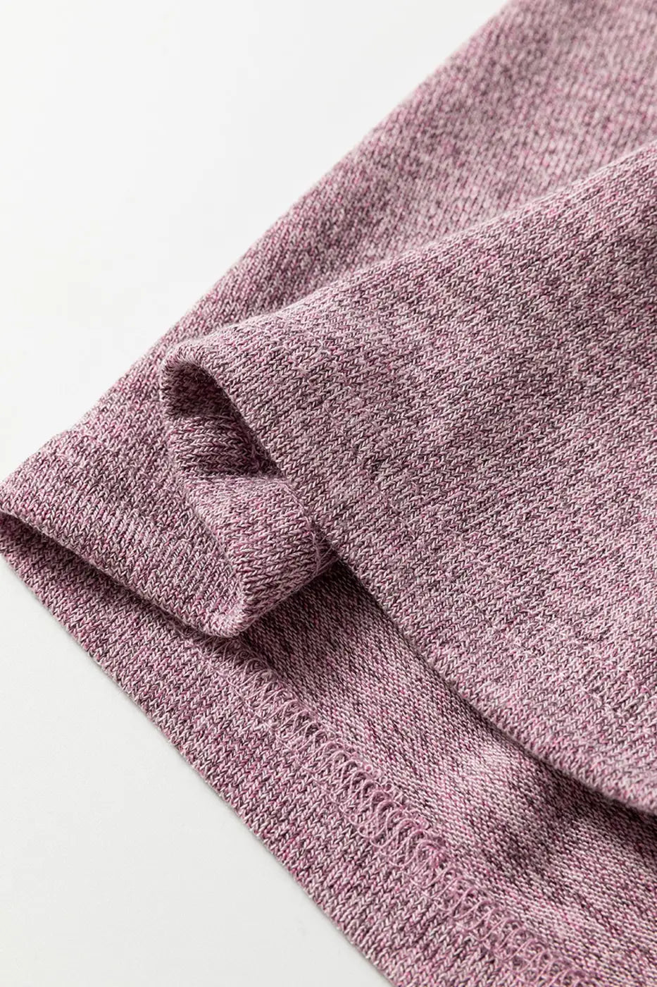 Close-up of soft knit heather mauve fabric from the Heather Mauve Duster Lounge Trio – 3‑Piece Loungewear Set, showcasing texture and stitching detail.