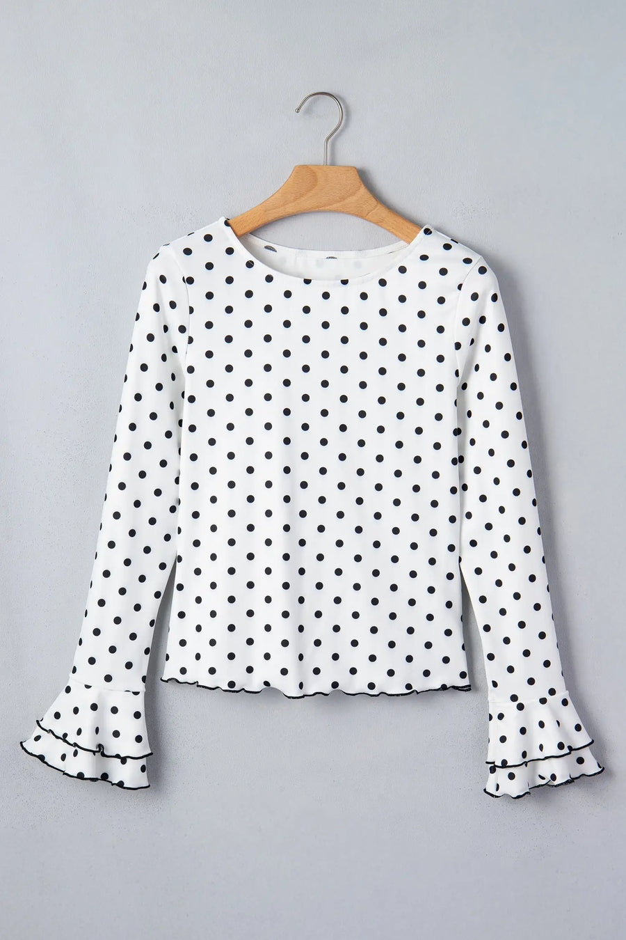 Black Polka Dot Print Lettuce Trim Long Sleeve Top — angled view | Fashionfitz UK