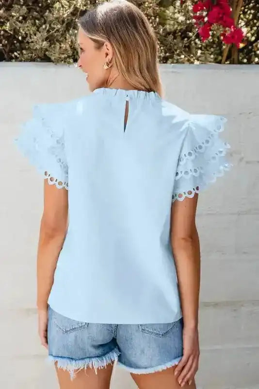 Side view of Blue Layered Ricrac Trim Blouse showing ruffle tier movement and lightweight fabric drape — Fashionfitz