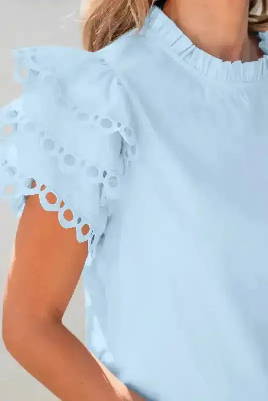 Back view of Blue Layered Ricrac Trim Blouse showing flowing ruffle tiers and relaxed silhouette — Fashionfitz