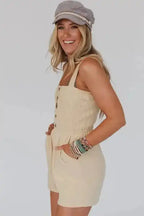 Beige Shirred Playsuit with front buttons and pockets, styled for a casual summer look. Light, breezy fabric perfect for daily wear.