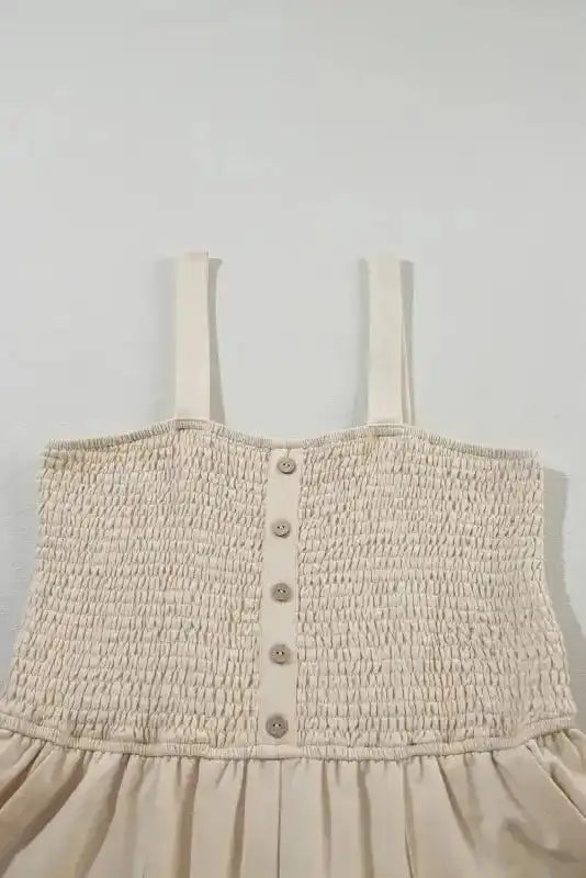 Beige Shirred Playsuit with front buttons and smocked bodice, perfect for a light and breezy casual look in warm weather.