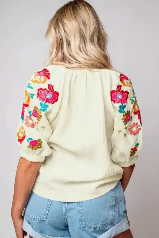Back view of Beige Floral Embroidered Ricrac Puff Sleeve Blouse showing ricrac trim at cuffs and hem — Fashionfitz