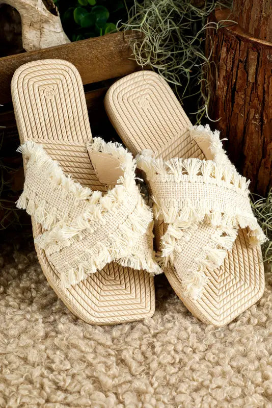 Beige tassel woven crossed straps flat slippers