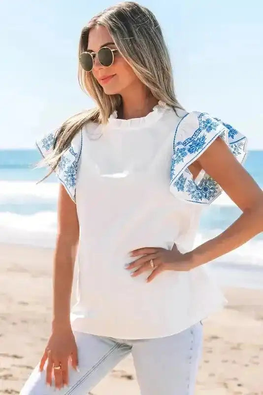 Back view of White Embroidered Ruffled Sleeve Frilled Collar Blouse showing ruffled sleeves and relaxed silhouette — Fashionfitz