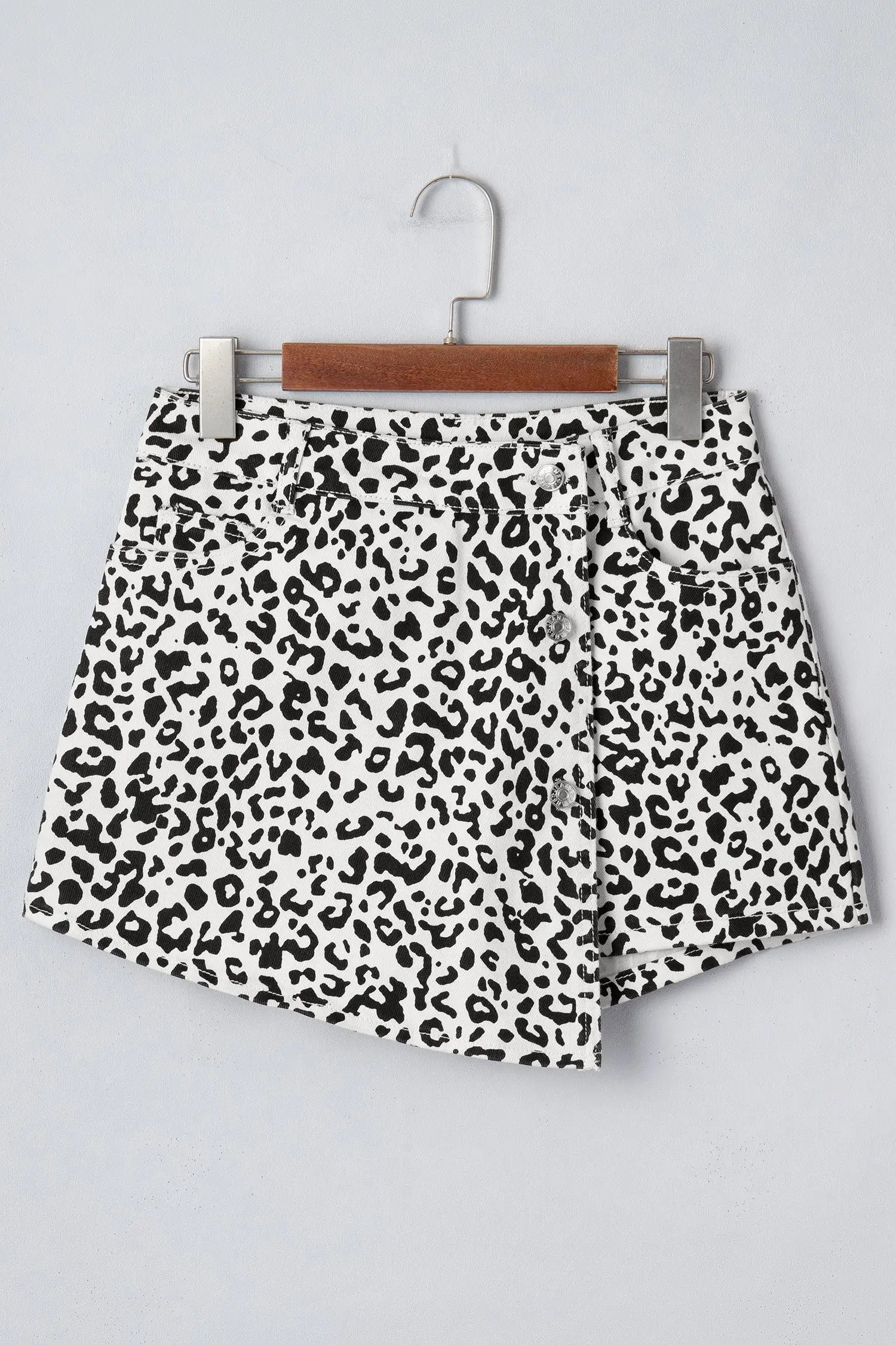Close-up of brown leopard print and button overlap on high waist denim shorts, Fashionfitz UK