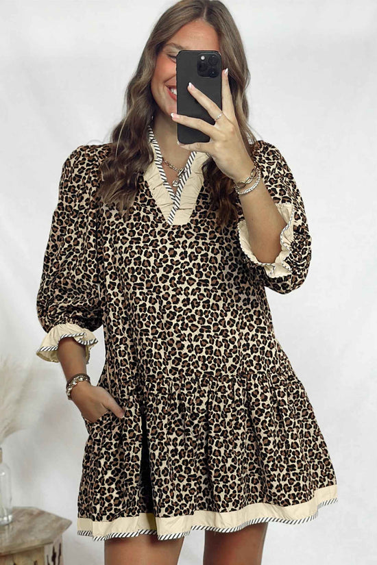 Model wearing Leopard Print Striped Trim Mini Dress with side pockets and flared skirt, perfect for summer western-style outfits.