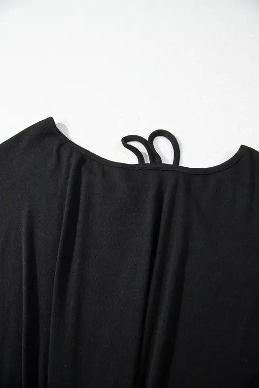 Black asymmetric strappy cold shoulder long sleeve top