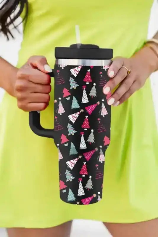 Trendy black Christmas tree printed thermos cup with handle and straw, designed for stylish sipping during the holiday season.