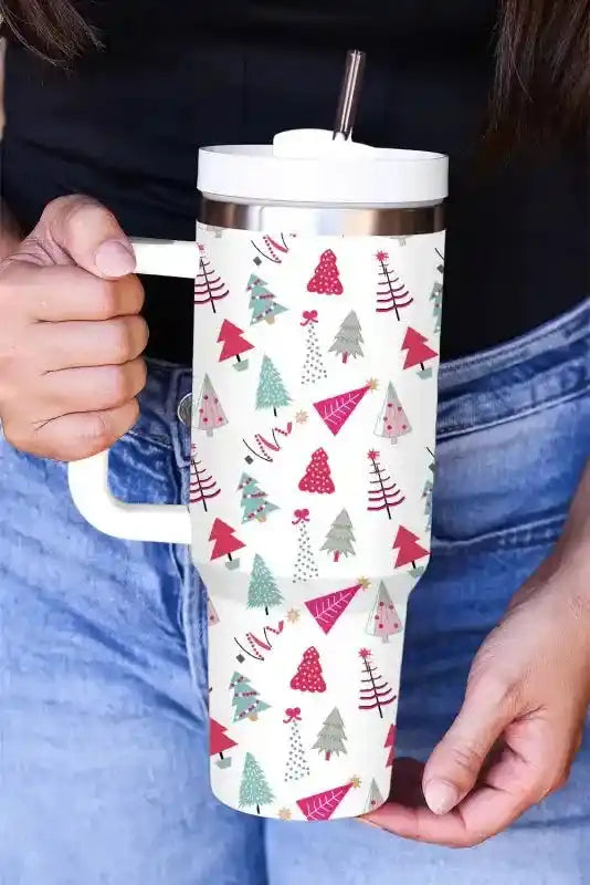 White thermos cup with colorful cartoon Christmas tree design, includes straw and handle, ideal for festive beverage enjoyment.