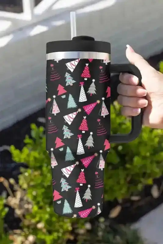 Black Cartoon Christmas Tree Thermos Cup with colorful tree print, ergonomic handle, and straw, ideal for holiday beverages on the go.