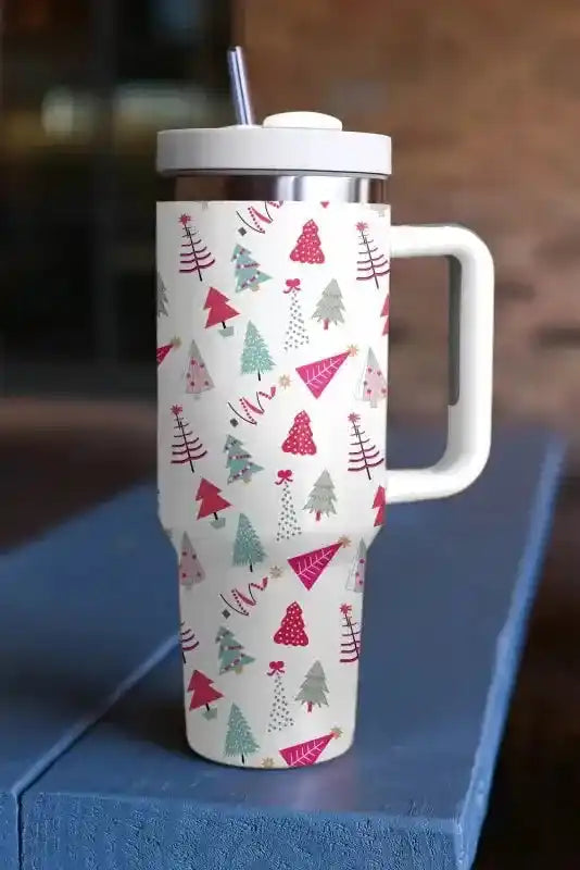 Festive Cartoon Christmas Tree Thermos Cup with colorful tree pattern, large handle, and straw, perfect for hot or cold drinks during the holidays.