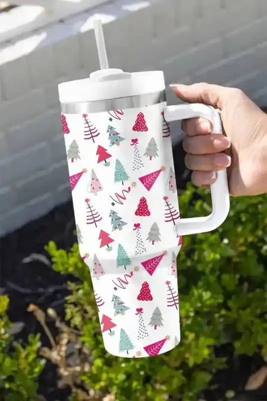 Trendy Cartoon Christmas Tree Thermos Cup with colorful tree illustrations, straw, and handle, ideal for Christmas gift or seasonal use.