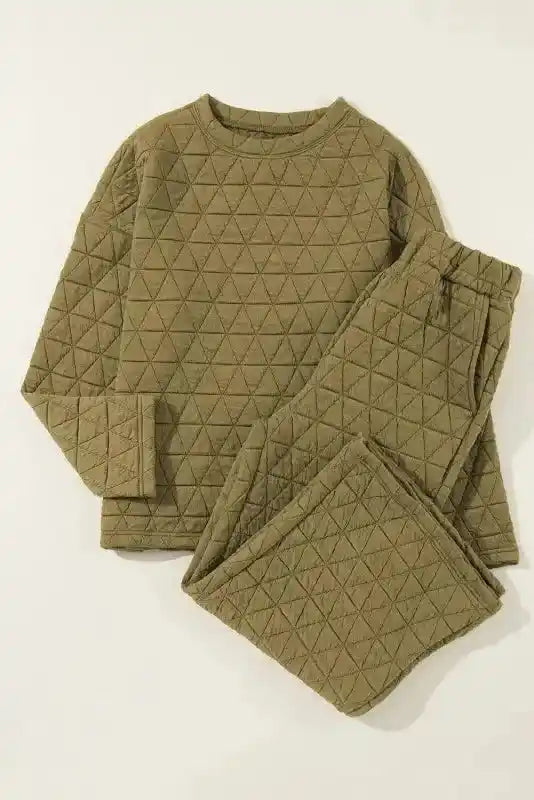 Olive green quilted loungewear set with long sleeves and pants, offering a cozy and modern fashion look.