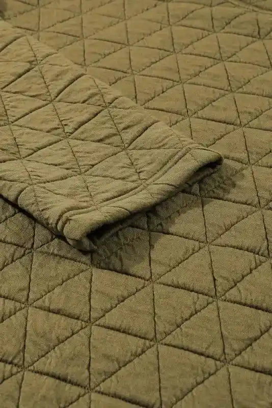 Sleeve detail of olive green quilted top from the modern style shorts set, highlighting soft texture and cozy design.