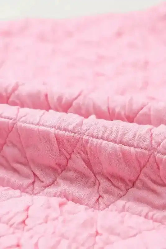 Detailed view of pink quilted fabric from the Modern Style Quilted Shorts Set - Black, highlighting plush texture and stitching.