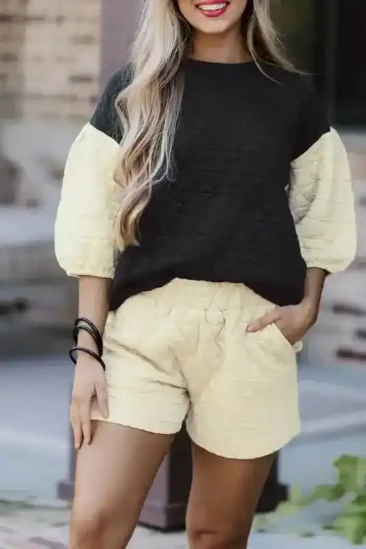 Modern style quilted shorts set in black and cream with 3/4 sleeves and high waist, perfect for cozy loungewear fashion.