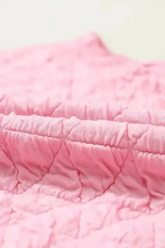Close-up of quilted fabric texture in pink from the Modern Style Quilted Shorts Set - Black, showing diamond stitching pattern.