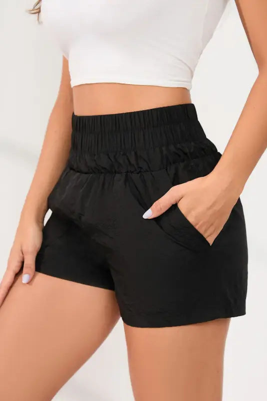 Black elastic high waist side pockets shorts