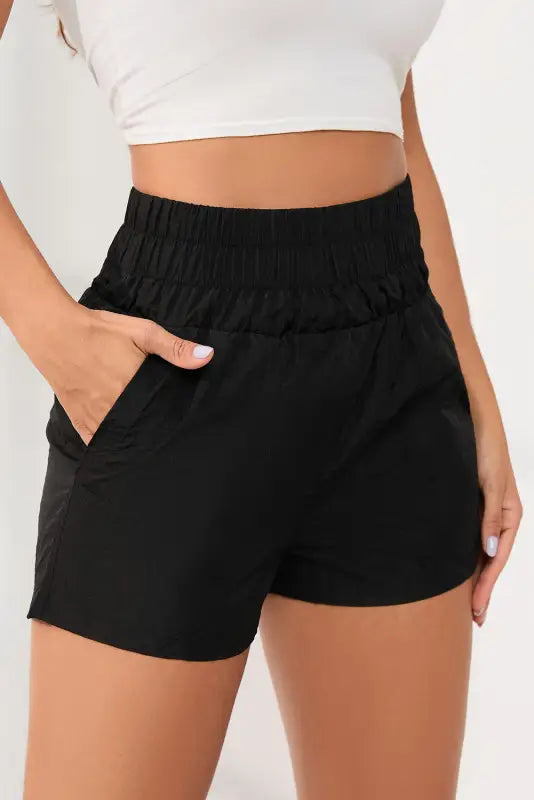 Black elastic high waist side pockets shorts