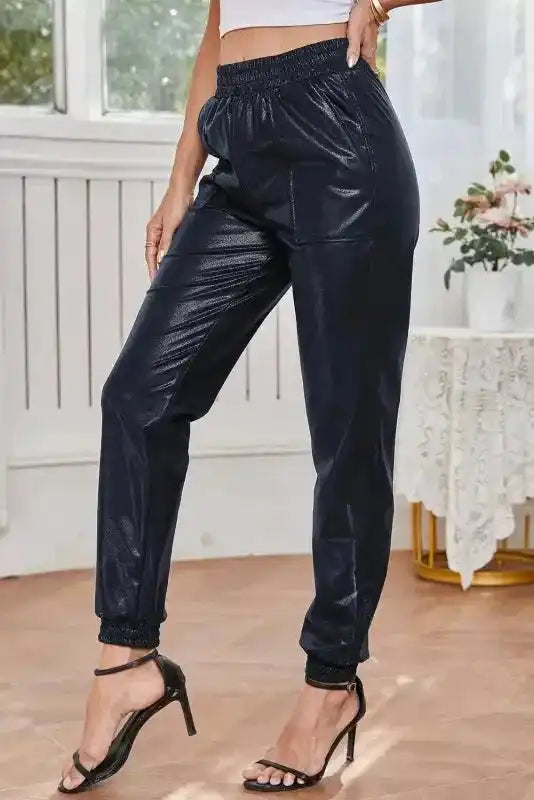 Side angle of Black Elastic Waist Pebble Joggers by FashionFitz showing the relaxed fit and subtle sheen of the PU leather fabric.