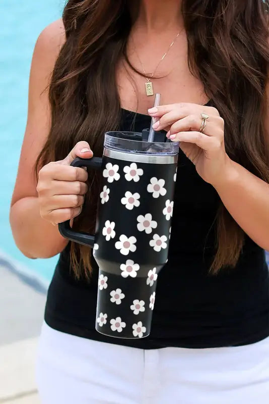 Black floret print stainless tumbler with lid and straw