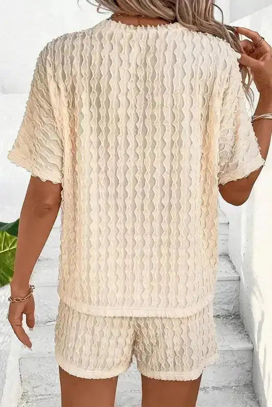 Back view of beige frill textured women's co-ord set. Features soft fabric and relaxed fit for casual comfort.