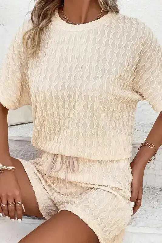 Women's cream frill textured co-ord set featuring a relaxed fit top and drawstring shorts. Great for lounging or vacation wear.