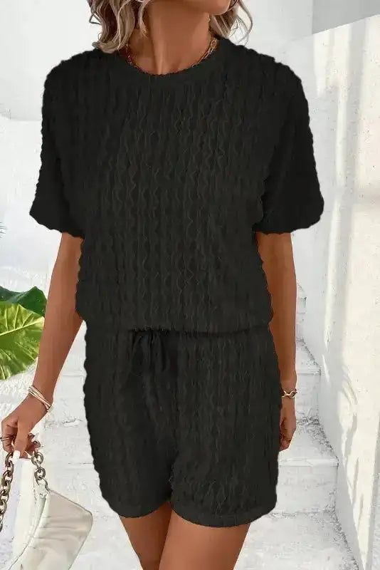 Frill textured black outfit set with crew neck top and elastic waist shorts. A stylish and comfy summer co-ord for women.