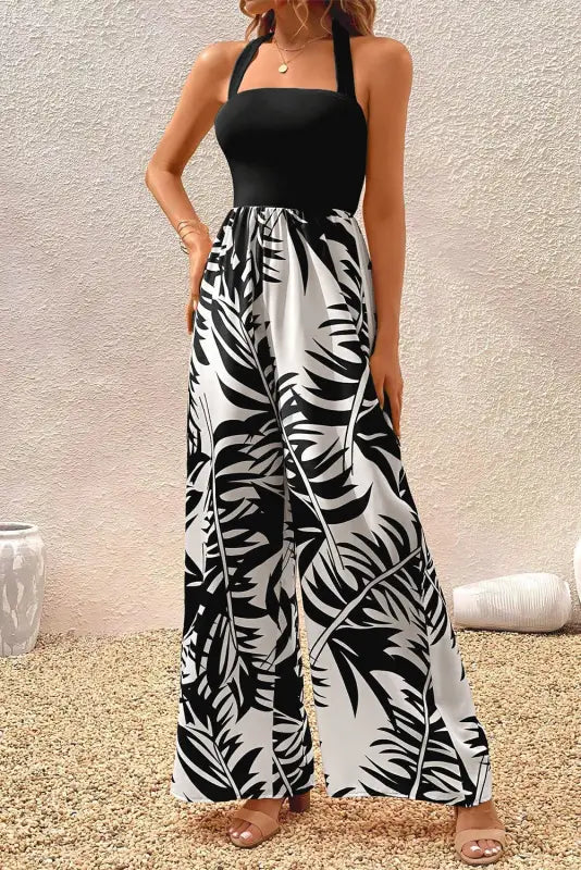 Black halter tropical wide leg jumpsuit - bottoms