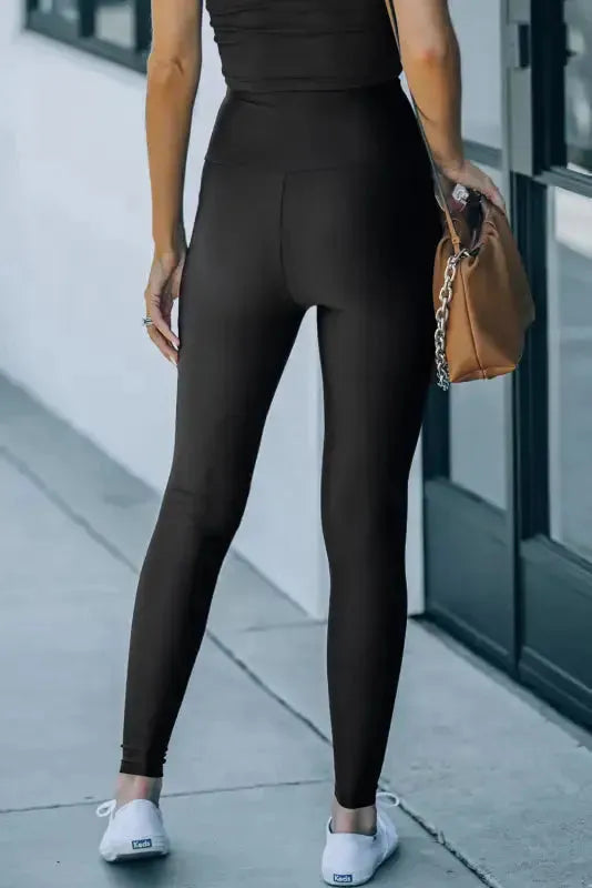 Side view of black waist cincher leggings showing wide waistband and hourglass shaping Fashionfitz UK