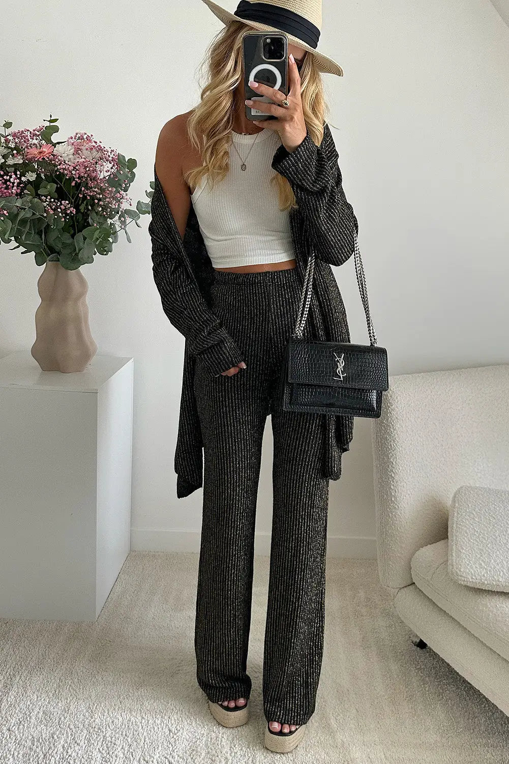 Black metallic ribbed cardigan and flare pants outfit -