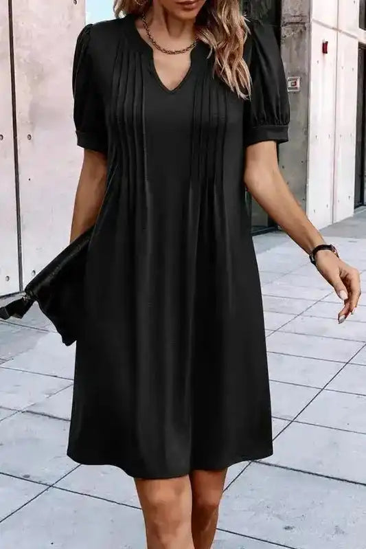 Black Notched Pleat Puff Sleeve Shift T-Shirt Dress with H-line silhouette and short puff sleeves, styled for modern summer wear.