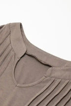 Detailed view of notched neckline and stitching on taupe Notched Pleat Puff Sleeve Shift T-Shirt Dress.