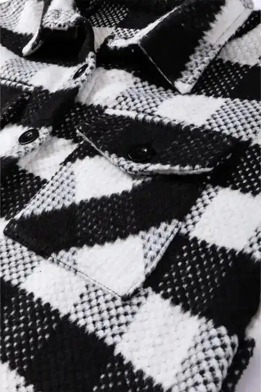 Chest pocket detail of black plaid shacket for winter outfits, highlighting flap design and cozy checkered fabric.