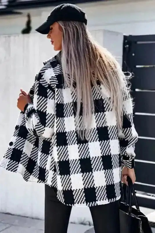 Back view of black plaid shacket for winter outfits, showcasing oversized fit and bold checkered pattern for daily wear.