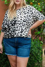 Close-up of plus size blouse featuring bold black and white leopard print and relaxed fit for casual summer outfits.