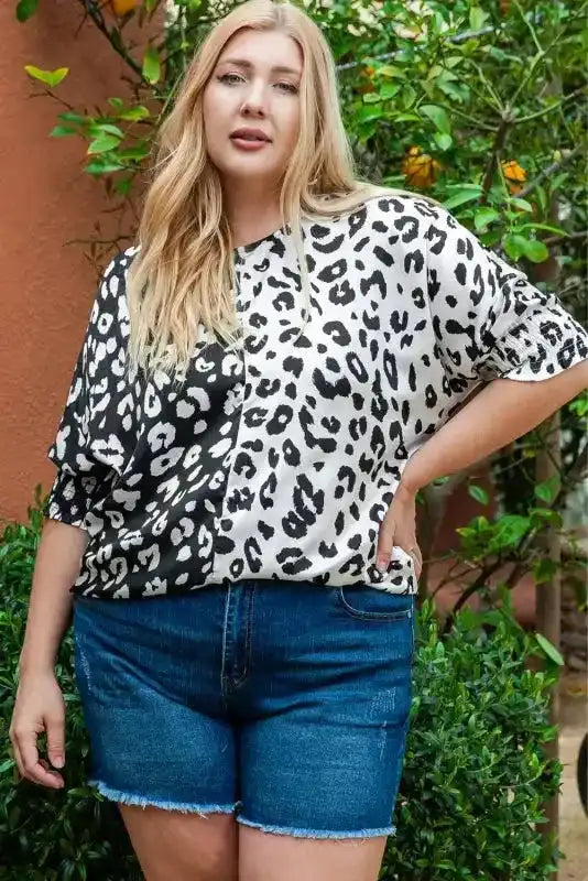 Front view of monochrome leopard print plus size blouse with half sleeves, styled for a casual western summer look.