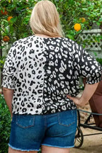 Back view of black and white leopard print plus size blouse with half sleeves and smocked cuffs, ideal for daily wear.