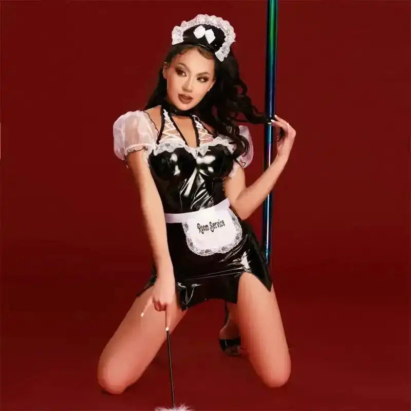 Model wearing seductive French maid uniform with shiny PU fabric and transparent mesh sleeves