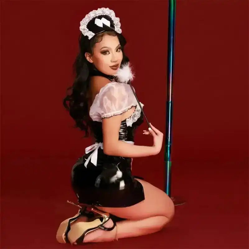 Back view of Black PU French Maid Costume with sheer mesh shoulders and matching accessories