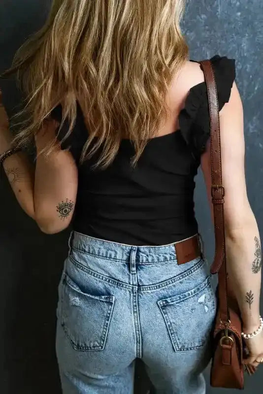 Sleeveless black crop top featuring feminine ruffle details and flattering fit - Fashionfitz