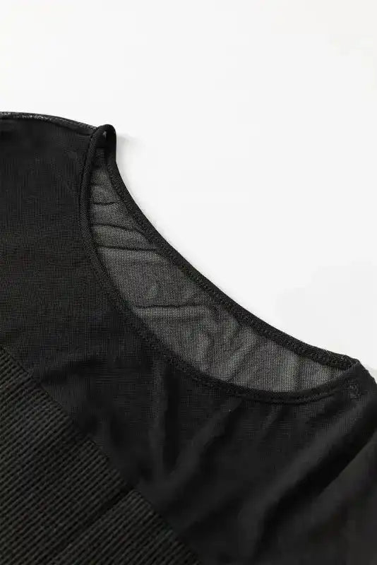 Detail of the sheer neckline on the Elegant Black Sequin Lantern Sleeve Blouse, showcasing its breathable and stylish mesh design.