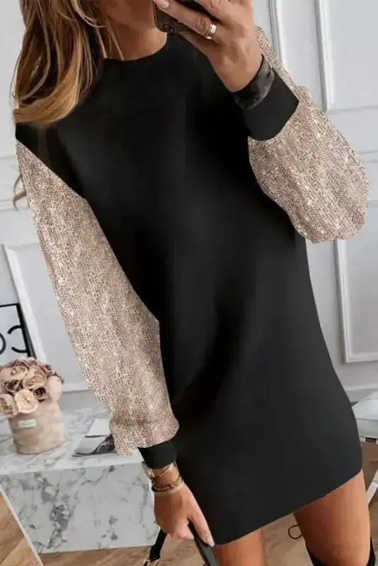 Black shift mini dress with rose gold sequin balloon sleeves, ideal for winter partywear and elegant evening occasions.
