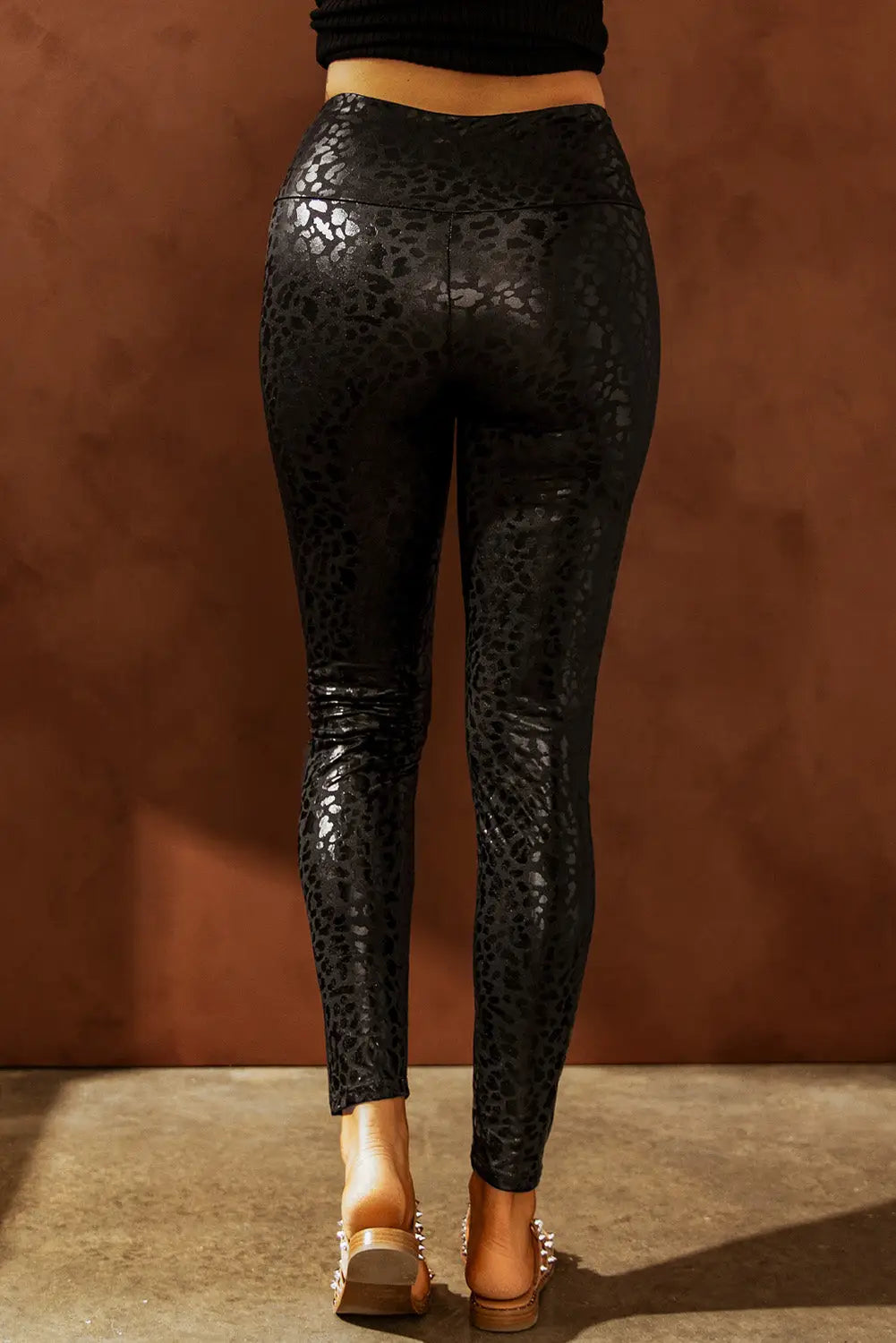 Black shiny leopard textured leggings - bottoms