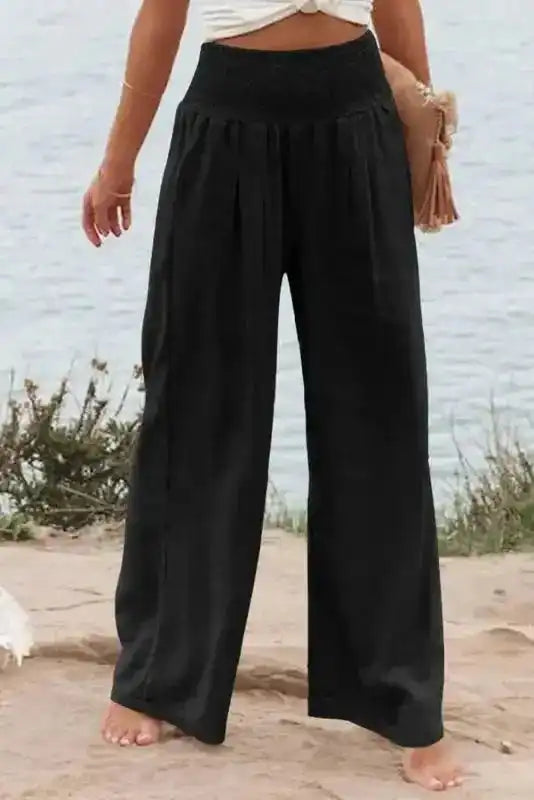 Black Shirred Wide Leg Pants for plus size women with high waist and relaxed fit, ideal for casual wear or vacation outfits in the UK.