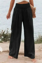 Black Shirred Wide Leg Pants for plus size women with high waist and relaxed fit, ideal for casual wear or vacation outfits in the UK.