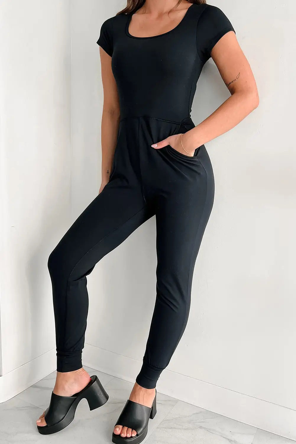 Black short sleeve pocket jogger bottom athleisure jumpsuit - s / 95% polyester + 5% elastane - jumpsuits & rompers