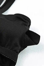 Inner stitching and padding detail of black tankini swimsuit top, designed for support and durability.