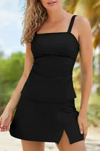 Close-up of black square neck tankini swimsuit highlighting the skirt slit and ruched waist for a stylish summer look.